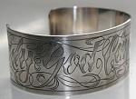 Tattoostyle engraves cuff bracelet.